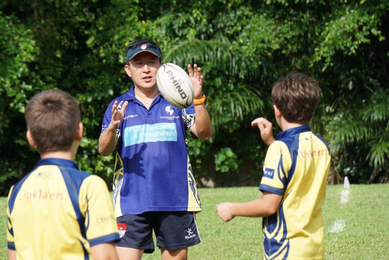 Centaurs kids rugby club Singapore coach giving tips to players