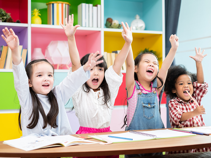 The Gifted Lab four toddler girls with hands raised learning differences