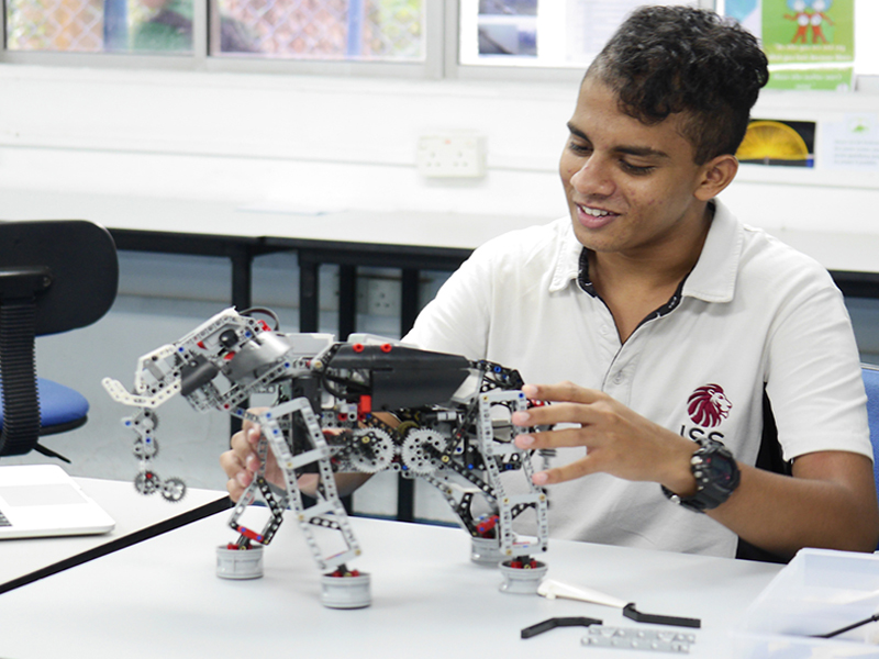 ISS International School student with a robot