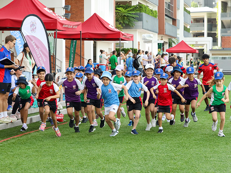 international students running sports at school - Dulwich College SG