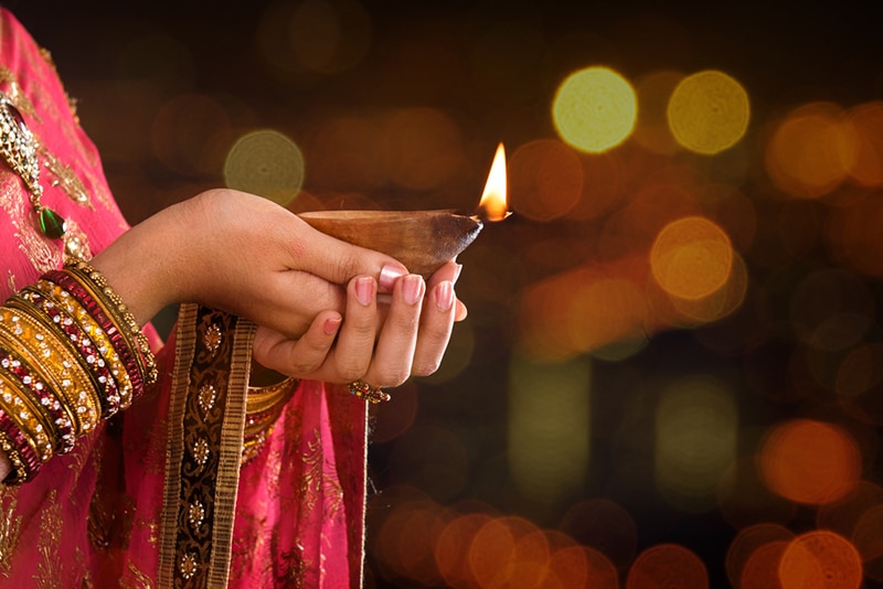 Deepavali woman hands light
