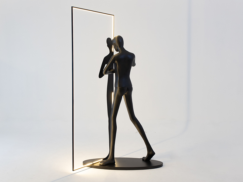 Man in Mirror patented design accent light in fibreglass and metal, Black & Walnut