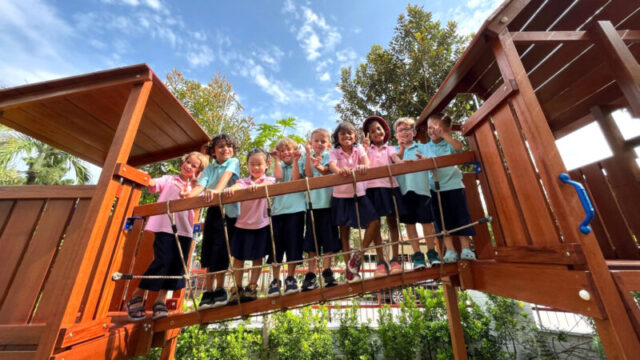Mosaic international preschool in Singapore students on wooden play bridge