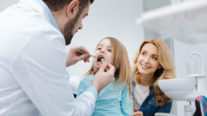 Pacific Prime dental insurance dentist and girl patient