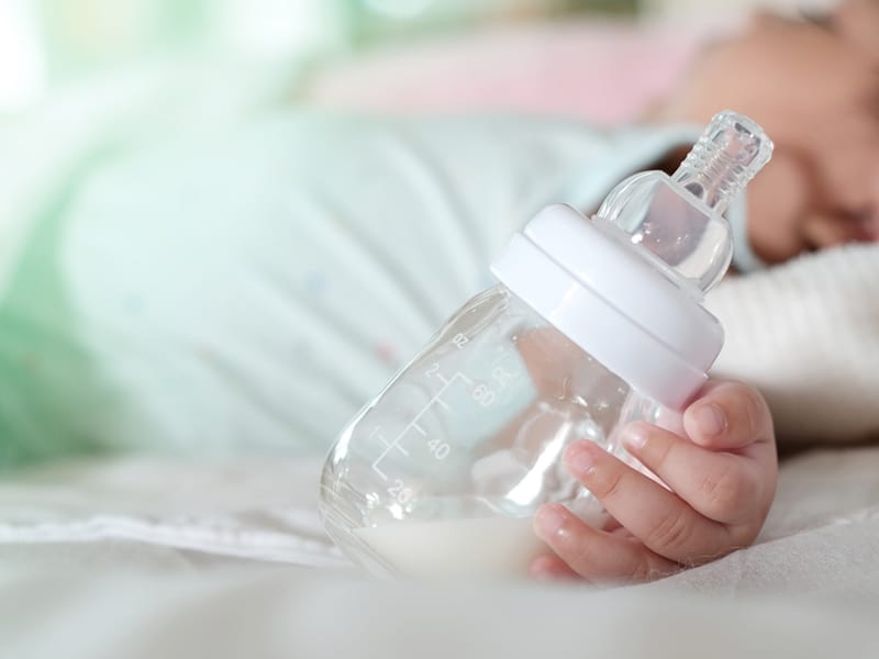 Pacific Prime dental insurance toddler sleeping with milk bottle