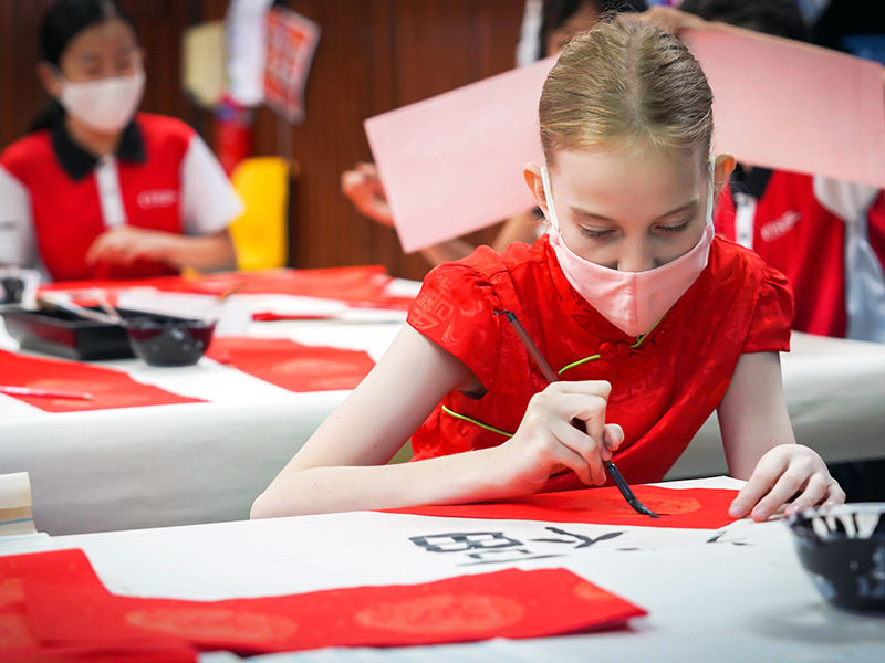 Canadian International School student in Chinese calligraphy lesson