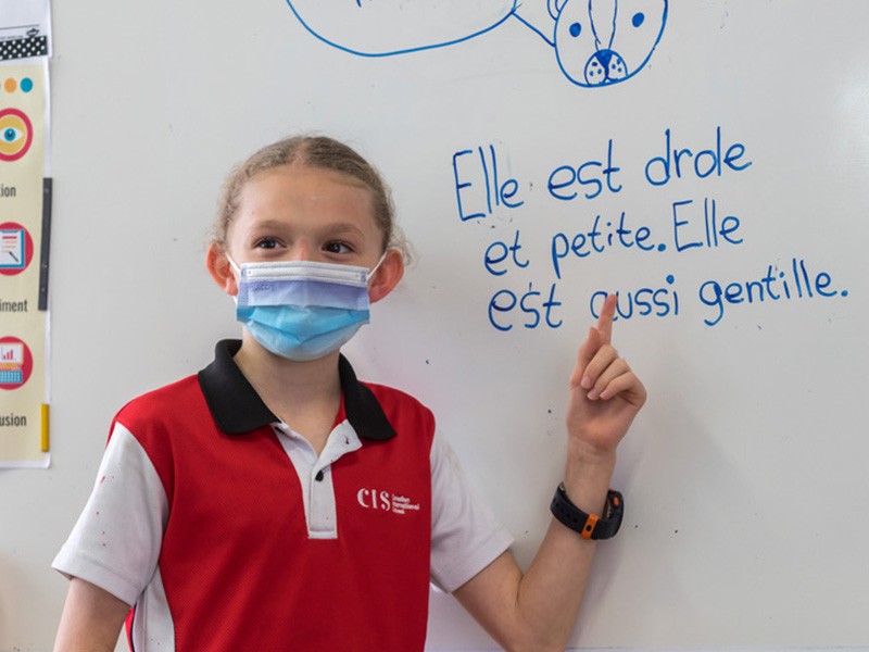 CanadianInternationalSchool female student translating during French class