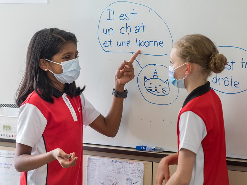 CanadianInternationalSchool two female students conversing during French school language programme