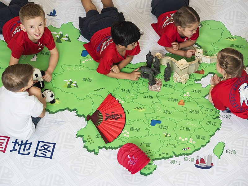 bilingual programme students learn mandarin in Singapore with a map - SAS