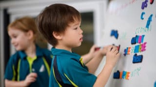 image of AIS student learning phonics