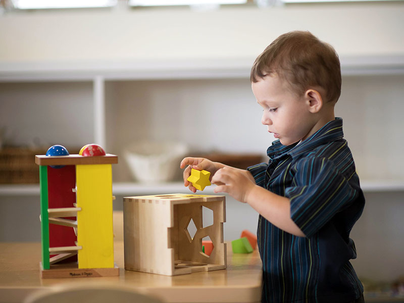 AIS preschool child playing with blocks