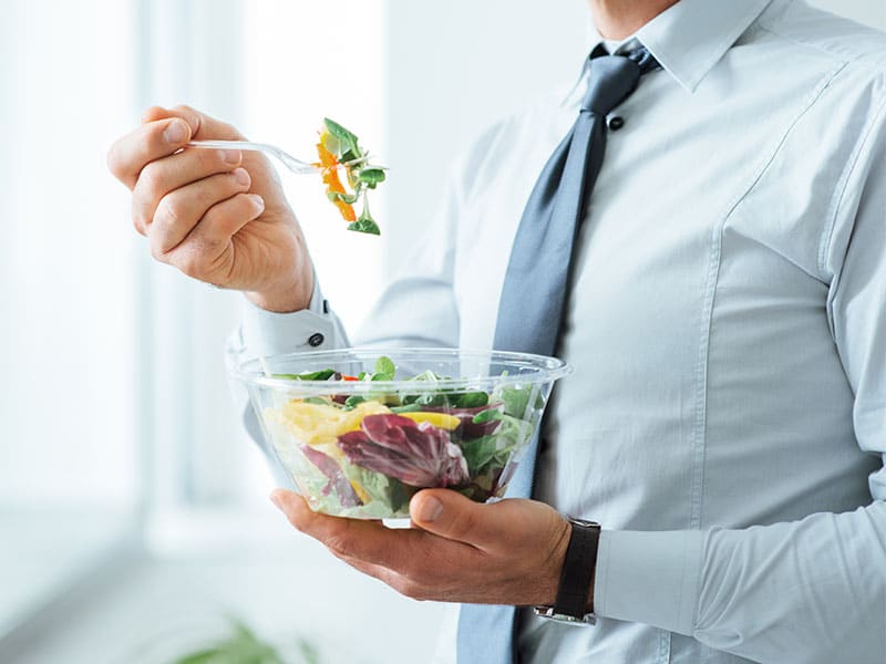 Mens Health - man eating salad