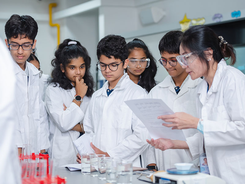 One World International School British curriculum school students in the science lab