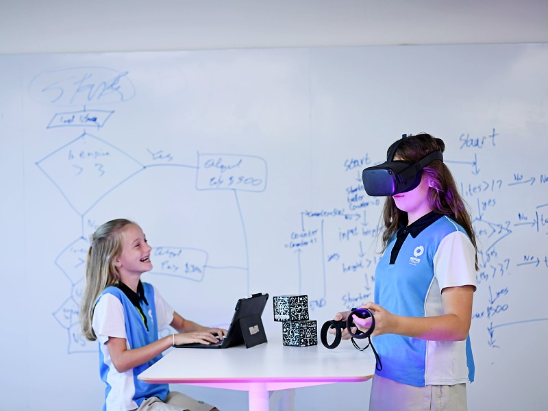 Two Nexus International School Singapore students exploring VR for STEAM