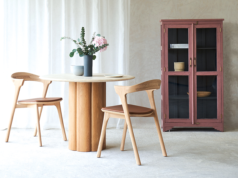 Kora round dining table with solid American walnut or oak timber base, clear satin lacquer finish and protective clear matt sealant on travertine top, Originals