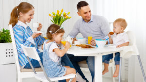 Pacific Prime family at breakfast hiring a domestic helper