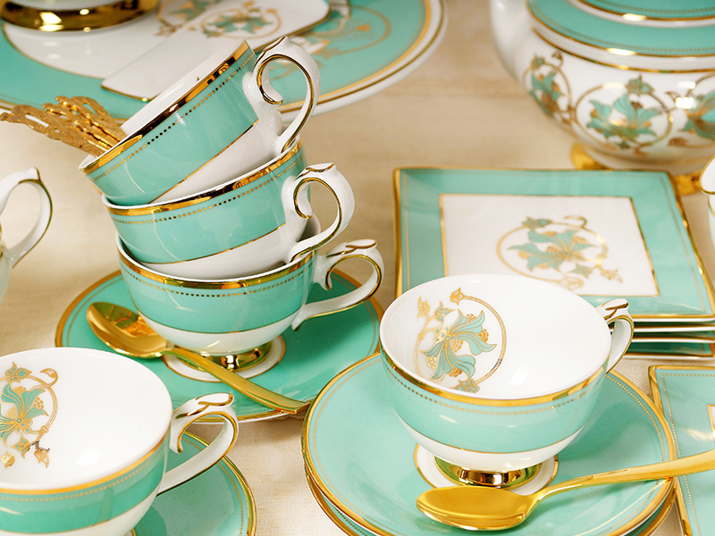 gold gilded cups and saucers
