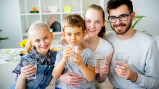 Family home cups of water benefits of drinking water