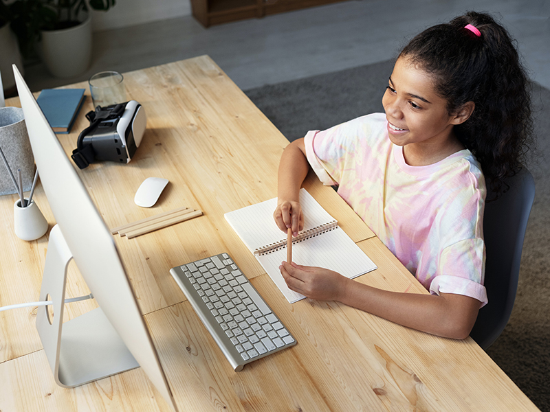 British Tutors online tutors girl in pink iMac