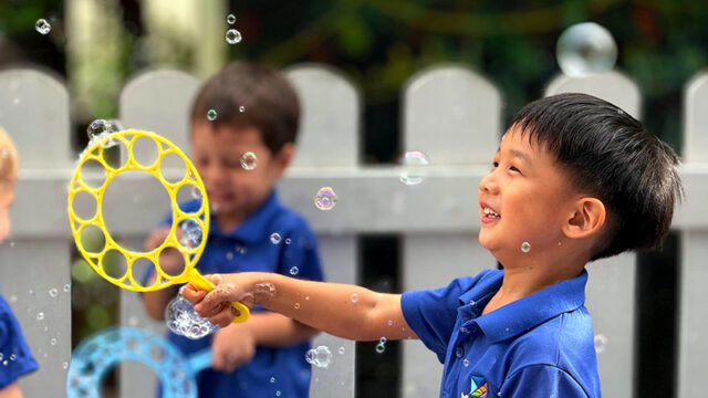 outdoor play with bubbles - Mosaic Singapore Preschool
