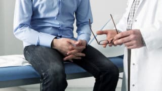 Discussing prostate cancer symptoms, screening and prostate cancer treatments with doctor