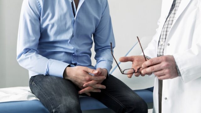 Discussing prostate cancer symptoms, screening and prostate cancer treatments with doctor
