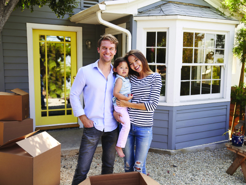 America Mortgages happy family in front of property in the US