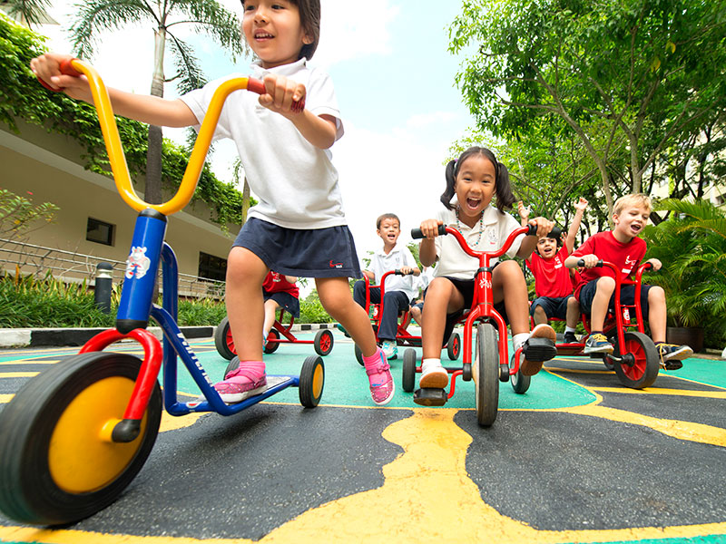 Singapore American School early years curriculum kids on bikes