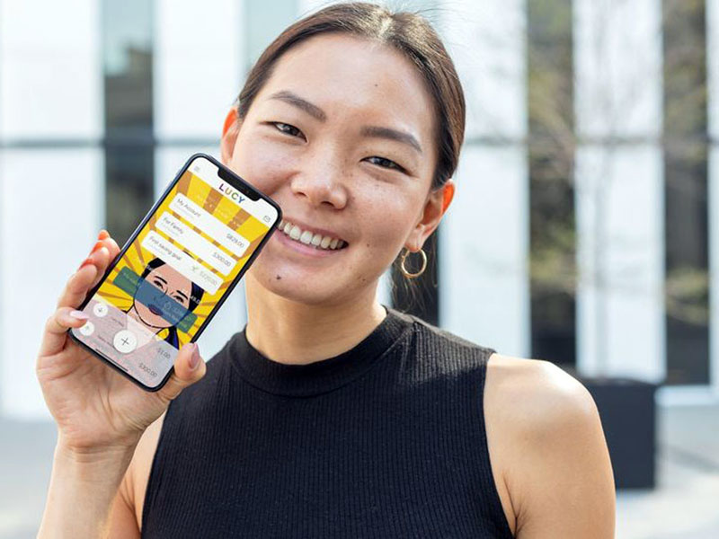 woman-holding-phone-with-Lucy-mobile-payments-app