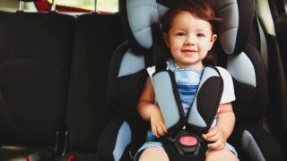 boy in clean baby car seat mould