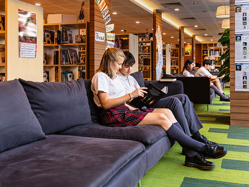 Dulwich College Singapore IBDP students reading in library
