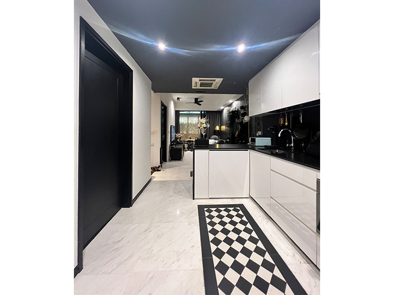 Kitchen in a black and white bungalow inspired Sophia Road condo