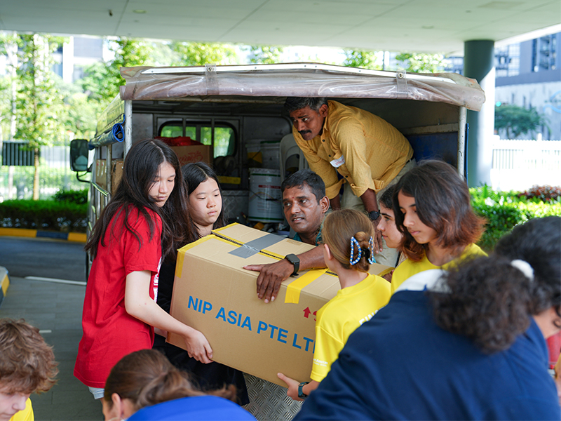 Stamford American students and migrant workers community service in Singapore