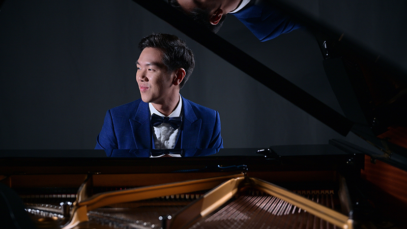 Congyu Wang Piano Island Festival Singapore founder at grand piano