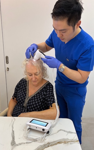 We visit Bay Aesthetics Clinic for a stem cell hair treatment in Singapore for androgenetic alopecia