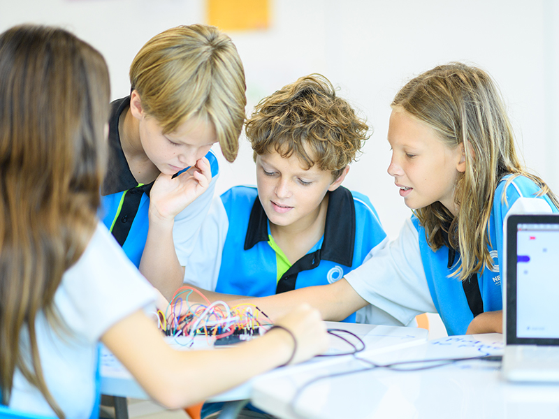 Nexus students using Arduino coding in STEM CCA