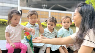 Trehaus preschool students outdoor with pet bird