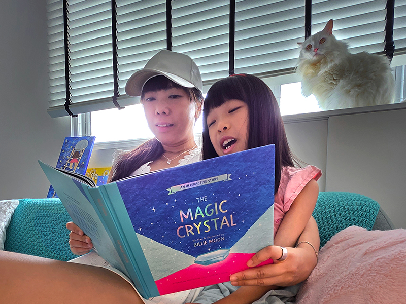 parent and child reading interactive book - The Magic Crystal book
