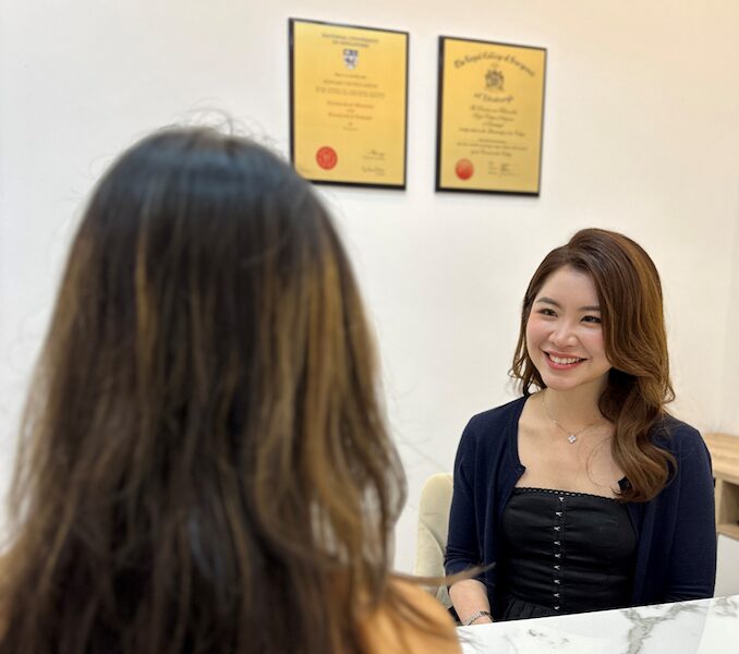Dr Hoe Ying Min, Medical Director of Bay Aesthetics Clinic, consulting a patient for collagen boosting injections