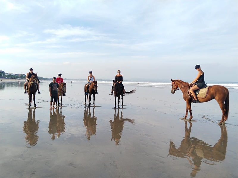 The Legian Seminyak, Beach Resorts Near Singapore in Bali horse riding on the beach