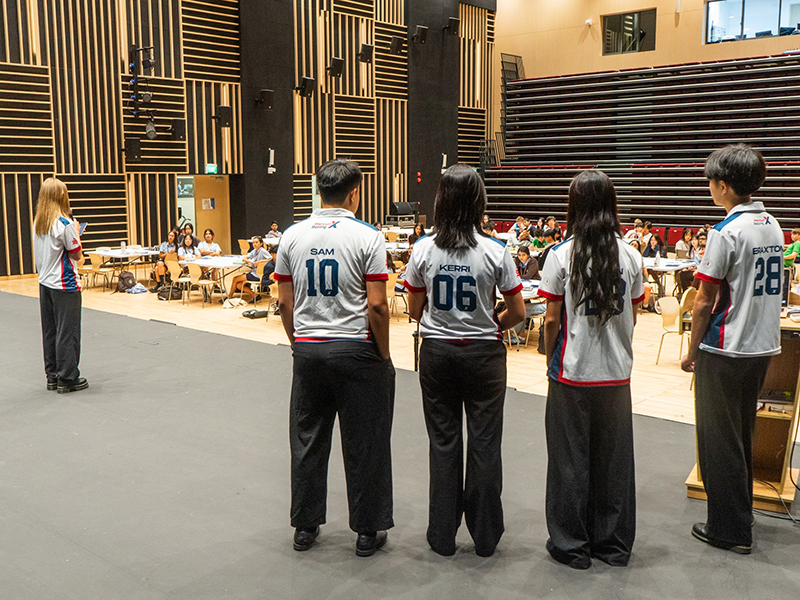 international students in Singapore on stage demonstrating student leadership